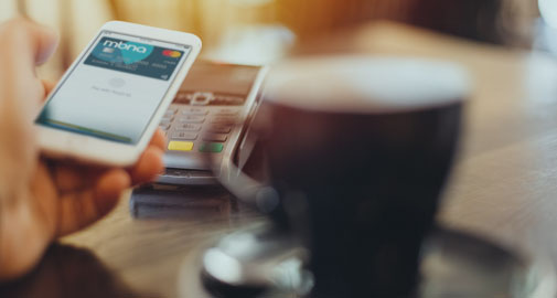 Person making contactless payment with MBNA credit card