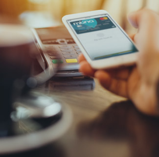 Person making contactless payment with smartphone