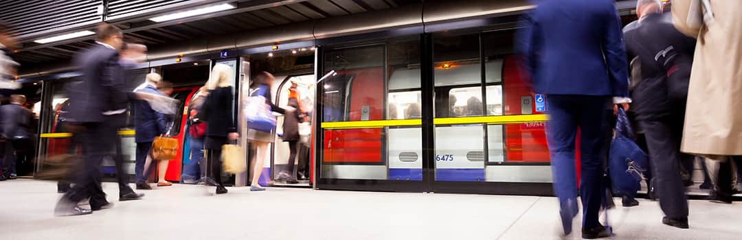 Commuters getting on tube