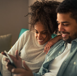 Man and woman looking at tablet