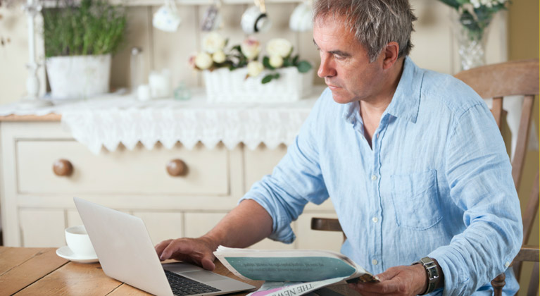 Man using a laptop on a table