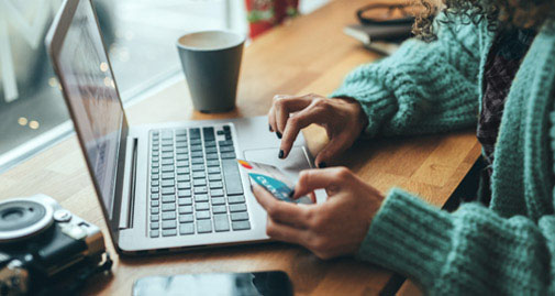 Woman making online purchase with an MBNA credit card