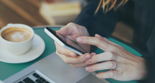 Woman looking at Google Pay on Smartphone