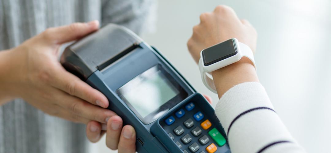Person paying with a smartwatch