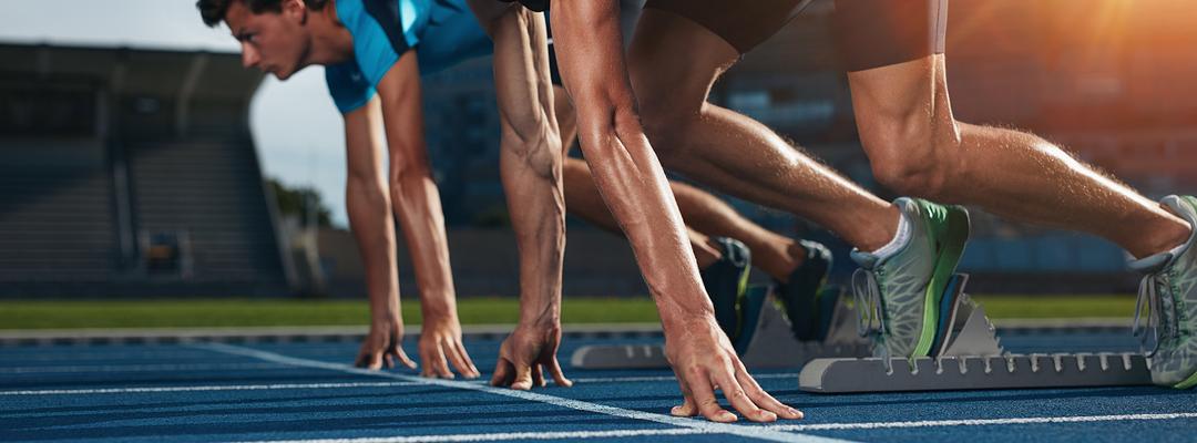 Men in stocks starting a race